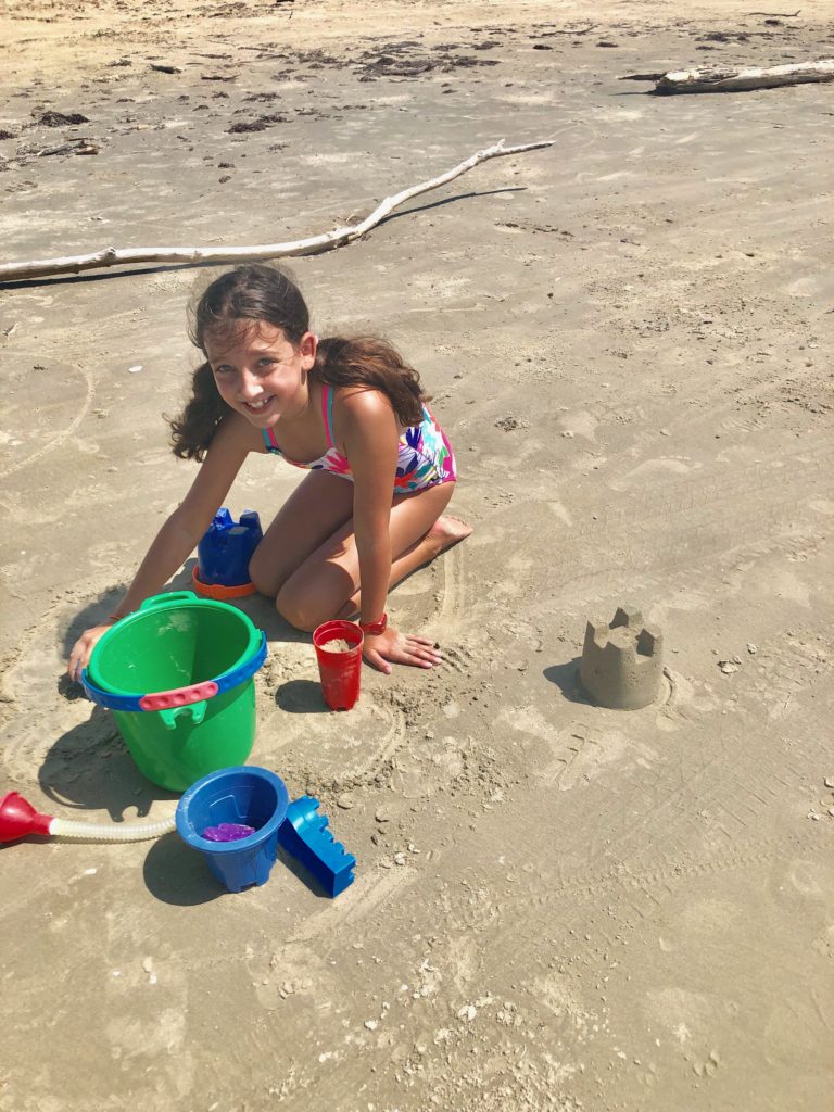 building sand castle at Galveston beach