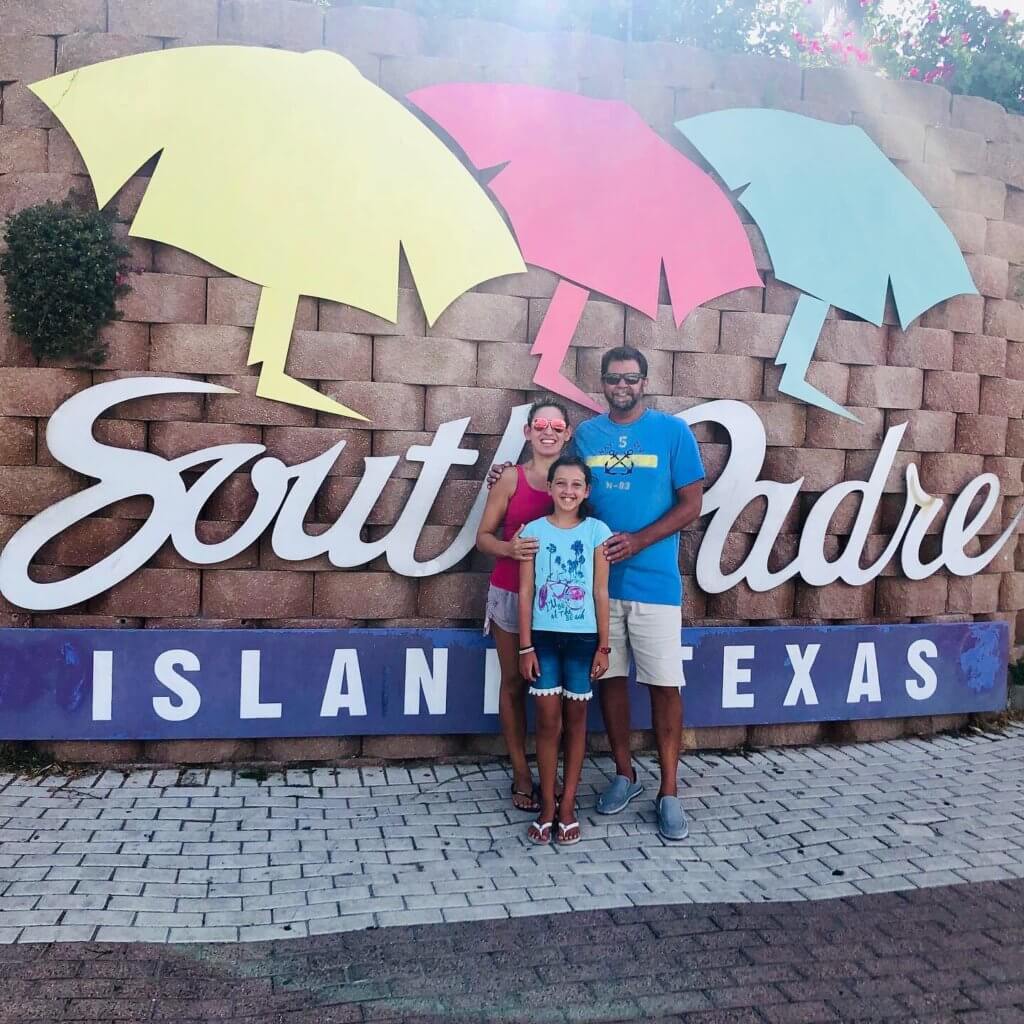 Family Picture in front of South Padre Island sign